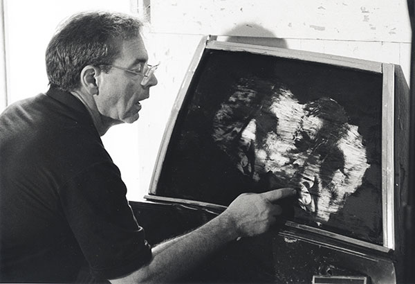 Photo of Dr. Bernard Herman working on one of his photographs
